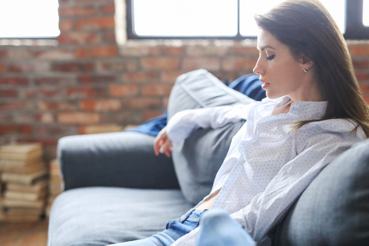 beautiful young woman relaxing sofa